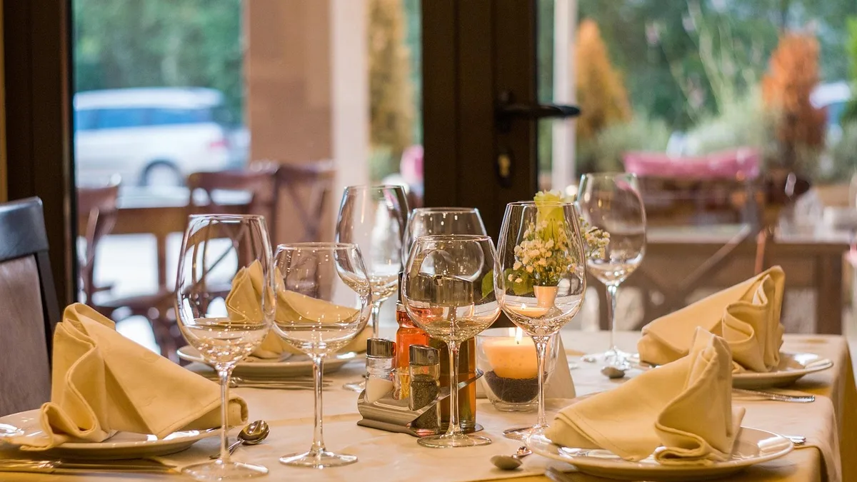Elegantly set dining table with glassware at a fine-dining restaurant